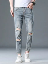 Men’s plus size slim fit distressed jeans in light wash denim with slight stretch ripped knees and frayed edges