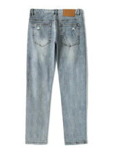 Men’s plus size slim fit light-wash denim jeans with distressed back pockets slight stretch and brown leather patch