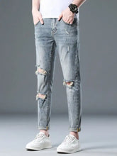 Men’s plus size light-wash slim fit distressed jeans with ripped knees slight stretch and rolled cuffs