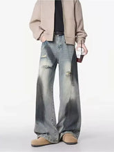 Men’s plus size distressed wide leg jeans in faded blue and dark gray wash with rips and frayed edges for vintage look