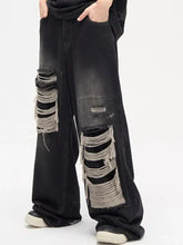 Men’s plus size black wide leg jeans featuring distressed layered frayed ripped patches on the thighs