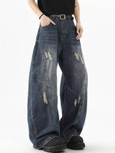 Mens plus size distressed wide leg jeans in dark blue denim with ripped patches and a relaxed fit design