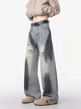 Men’s plus size distressed wide leg denim jeans with a faded look and intentional tear details