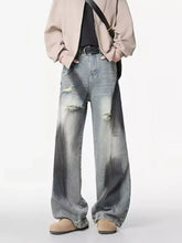 Men’s plus size distressed wide leg denim jeans in faded gray wash with intentional distressing at the knees