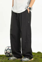 Mens plus size drawstring loose fit pants in black with button details