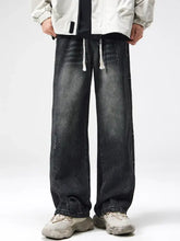 Men plus size dark-wash denim jeans with white drawstrings and wide-leg drape for relaxed comfort and style