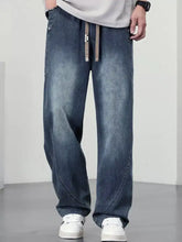 Men’s plus size blue denim jeans with a relaxed wide leg cut and contrasting stitching details