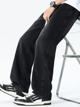 Men’s plus size drawstring wide leg black denim jeans with straight-leg cut and subtle fading along the thighs
