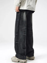 Men plus size dark-wash denim jeans with a wide-leg drape and subtle distressed details in a drawstring style
