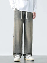 Men’s plus size drawstring wide leg jeans in gray denim with a faded wash and subtle side panel detailing
