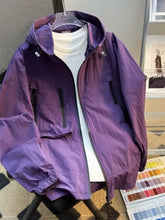 Men’s plus size lightweight purple hooded windbreaker jacket with black zipper accents and drawstring cuffs on hanger
