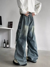 Men’s plus size loose fit cargo jeans in faded blue denim with wide-leg and cargo pockets and a drawstring waist
