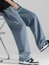 Men’s plus size loose fit drawstring jeans in light-wash denim with a relaxed straight-leg cut