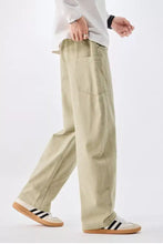 Men’s plus size beige cargo drawstring waist jeans with relaxed fit and multiple pockets for comfort and utility