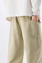 Beige men’s plus size wide-leg drawstring waist jeans with relaxed fit and visible pocket stitching