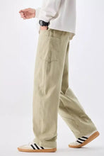 Mens plus size loose fit khaki cargo drawstring waist jeans with visible stitching and front pocket