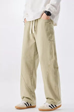 Men’s plus size beige cargo pants with a relaxed fit and drawstring waist featuring side pockets waist jeans
