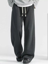 Men’s plus size loose fit wide leg jeans in black with drawstring waist and contrasting white stitching