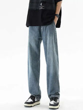 Men’s plus size loose fit light-wash denim jeans with relaxed straight-leg cut and subtle fading for casual wear