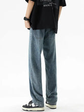 Men’s plus size loose fit jeans in light-wash denim with a relaxed straight-leg cut and classic front pockets