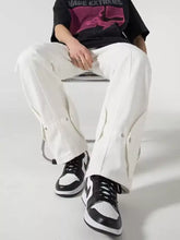 Men’s plus size loose fit jeans in white cargo style with side pockets and buttoned flaps for a relaxed fit