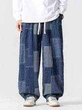 Men’s plus size blue patchwork wide leg denim jeans with relaxed fit and white drawstrings