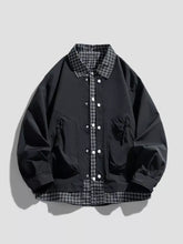 Men’s plus size plaid trim snap bomber jacket in black with black and white plaid collar hem and white buttons down front