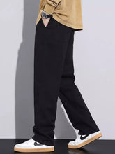 Men’s plus size relaxed fit drawstring jeans in black soft cotton fabric with tapered legs and subtle side pockets