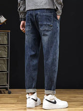 Men’s plus size relaxed fit dark blue denim jeans with drawstring waist and rolled cuffs for casual comfort