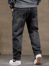 Men’s plus size relaxed fit drawstring waist dark-wash denim jeans shown from the back with classic pockets