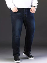 Men’s plus size dark blue denim relaxed fit jeans with subtle fading and contrast stitching along the seams
