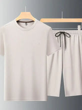 Men’s plus size cream-colored cotton short sleeve round neck top with subtle embroidered chest logo and matching shorts set