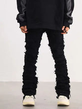 Men’s plus size slim fit black distressed denim jeans with frayed hem and ruffled leg detailing