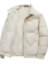 Cream-colored plus size snap quilted puffer jacket with button-front closure and subtle stitching details for winter