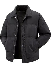 Men’s plus size black puffer jacket with quilted design and silver snap buttons ideal for cold weather