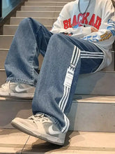 Men’s plus size striped wide-leg jeans in blue denim with white side stripes and a vertical label patch
