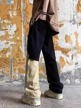 Men’s plus size wide-leg jeans in black and beige patchwork denim with a relaxed fit and ripped design