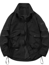 Men’s plus size urban style black tactical jacket with hood, flap pockets with silver buttons, and hem drawstrings
