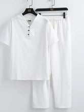 Men’s plus size white short sleeve v-neck button-up top and matching pants set displayed on black hangers