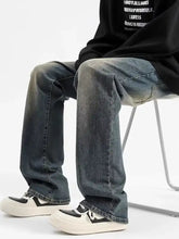Men’s plus size vintage wash jeans in dark-wash denim with loose fit straight-leg cut and rolled cuffs
