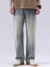 Men’s plus size vintage wash loose fit light-wash denim jeans with relaxed straight-leg cut and subtle thigh fading