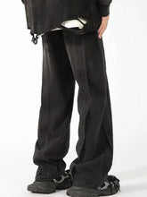 Men’s plus size black denim jeans with vintage wash wide leg fit and distressed ripped hem with visible stitching details