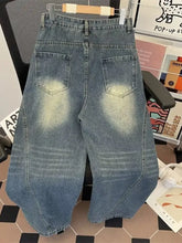 Men’s plus size vintage wash wide-leg jeans in faded blue denim with high waist and subtle whiskering details
