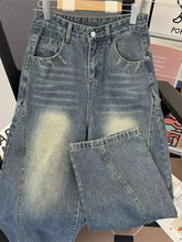 Men’s plus size vintage wash wide-leg jeans in high-waisted faded blue denim with subtle distressing details
