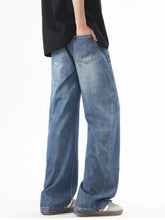 Men’s plus size wide leg jeans in blue denim with faded wash and visible stitching featuring a drawstring waist