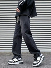 Men’s plus size black denim straight leg jeans with relaxed fit and white drawstrings at the waist