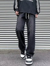Men’s plus size black denim straight leg jeans with relaxed fit and visible stitching details