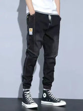 Mens plus size black washed jeans with drawstring waist and patch pocket detailing in denim jogger style