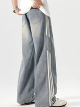 Men’s plus size washed light-wash denim wide leg jeans with three vertical white side stripes on the outer leg