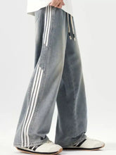 Men’s plus size washed light-wash denim wide leg jeans with three white stripes and drawstring waistband